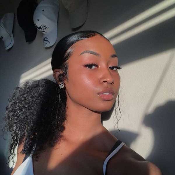 Zalizana tamna kovrdžava kosa